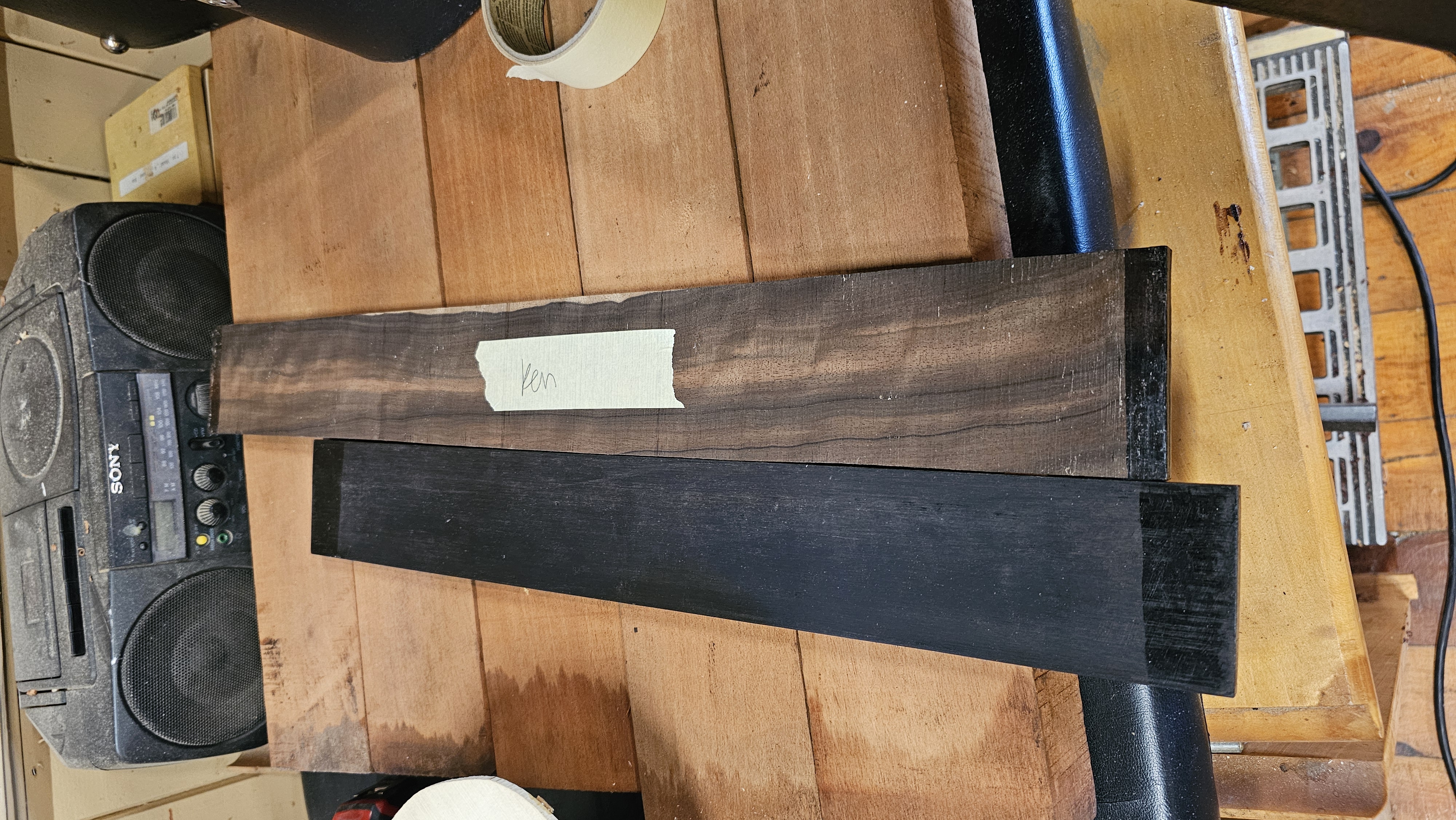 Raw ebony headstock plates (left) and fretboard (right)
